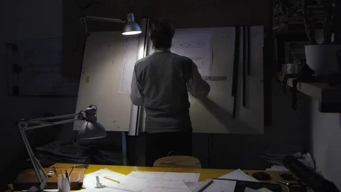 Engineer Draws a Technical Drawing on Drawing Board Stock Footage 99233702