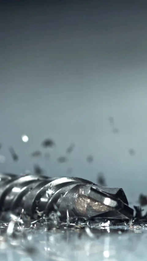 Engineer drill test flute swarf slowmotion study Filmed on a high-speed camera Video stock 335396115