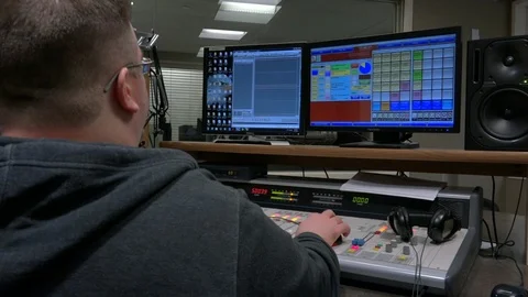 Engineer editing audio from behind Stock-Footage 118724830