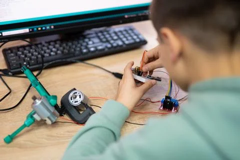 An engineer is engaged in the development and layout of electrical circuits.. Stock Photos