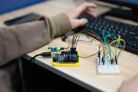 An engineer is engaged in the development and layout of electrical circuits Stock Photos