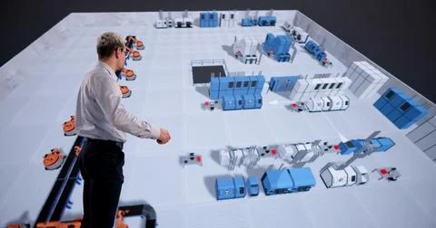 Engineer Enhancing Industrial Machine Configuration With 3D Visualization And Stock Photos