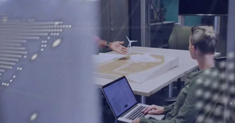 Engineer entering and pointing tablet while colleague typing reviewing turbine Stock Footage 331197754