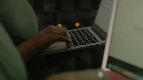An engineer enters data into a laptop in a mining farm 스톡 동영상 96065188