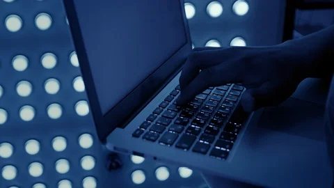 An engineer enters data into a laptop in a mining farm Stock-Footage 98258845
