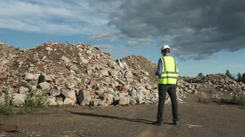 The engineer estimates the amount of construction waste removed Video stock 157821851