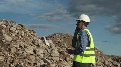 The engineer estimates the amount of construction waste removed Stock Photos
