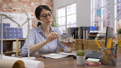 Engineer examine architect model on notebook pc. Stock Footage 127945550