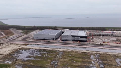 Engineer Examines Artificial Structures And Heavy Machinery On New Coastal Stock Footage 325453097