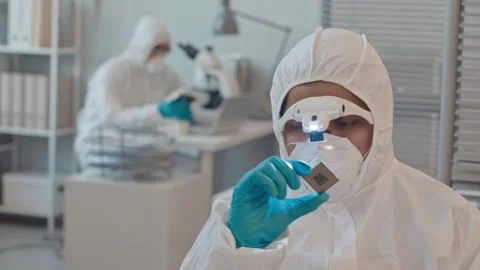 Engineer Examines Microchip in High-Tech Laboratory Stock Footage 321036314