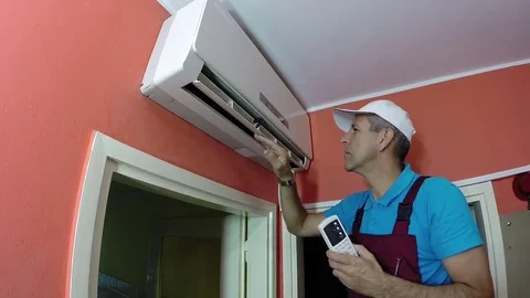 Engineer Examining Air Conditioning System Stock Footage 69199335