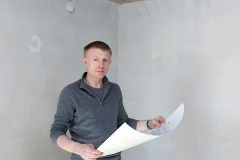 An engineer examining blueprints Stock Photos