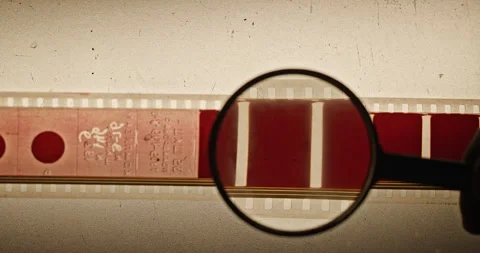 Engineer Examining Film Quality Under Magnification Stock-Footage 305089237
