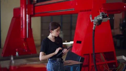 Engineer Examining Industrial Machinery with Tablet Stock Footage 280749618