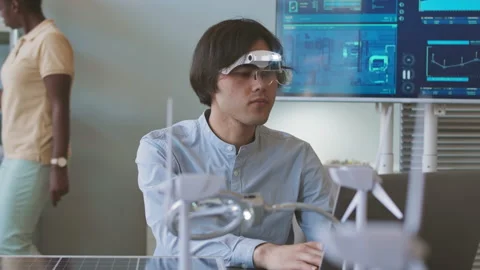 Engineer Examining Solar Panel in Office Stock Footage 211636953