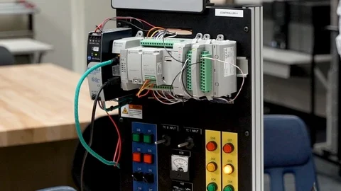 Engineer examining testing panel with lights Stock Footage 93247633