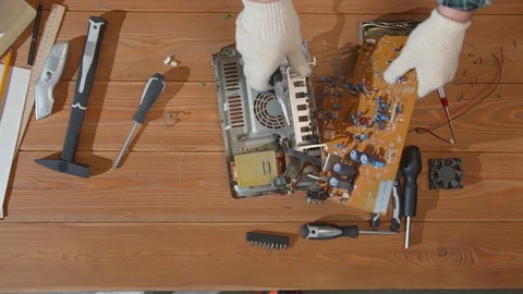 Engineer extracts chip from circuit with wire cutter Stock Footage 129982107