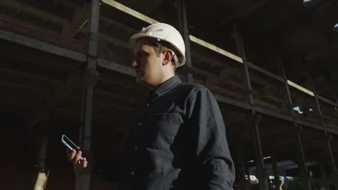 An engineer at the facility is talking over video communication on the phone Stock Footage 138930027