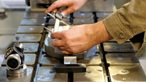 Engineer In Factory With Apprentice Checks Component Quality. Stock Footage 101976337