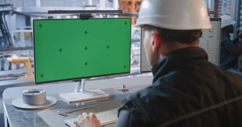 Engineer at Factory Control Desk with Green Screen Monitor in Glass Office Stock Footage 344395015