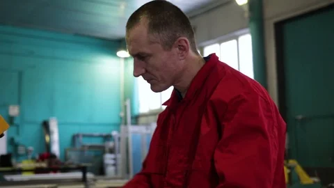 Engineer at the factory. The engineer takes notes. Engineer builder on the const Stock Footage 100879653