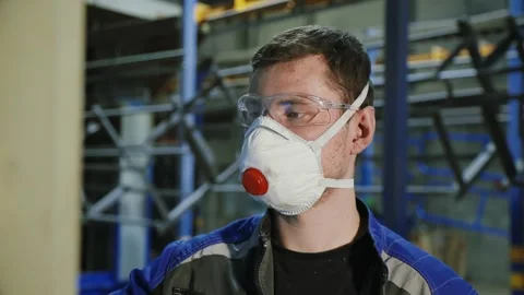 An engineer at the factory in the raspirator controls the machine Stock Footage 264261047