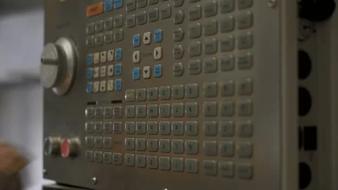 Engineer at the factory starts the injection machine. 4K Stock Footage 115274991