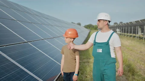 Engineer father is explaining to his little son an operation and performance of Stock Footage 158821831