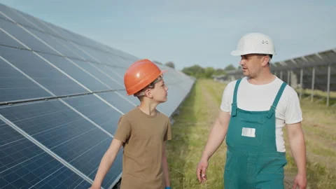 Engineer father is explaining to his little son an operation and performance of Stock Footage 158822030