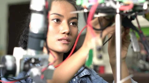 Engineer female collaborating development robot in modern laboratory. Stock Footage 113011974