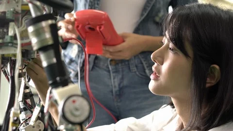Engineer female collaborating development robot in modern laboratory. Stock Footage 113012691