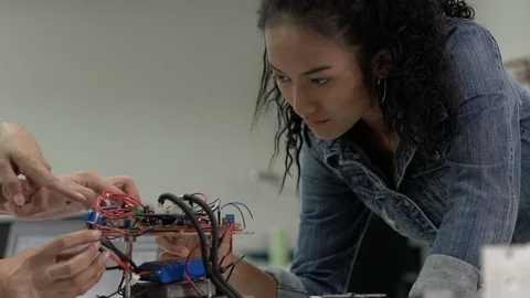 Engineer female collaborating development robot in modern laboratory. 스톡 동영상 113704812