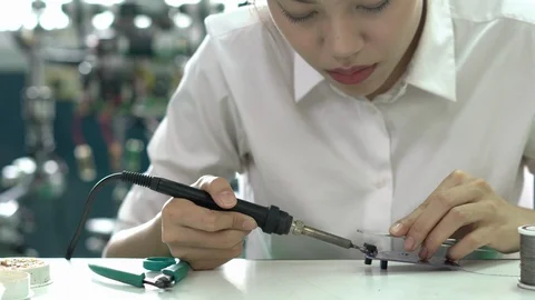 Engineer female design and developing microchip electronic of robot in labs. Stock Footage 112990370