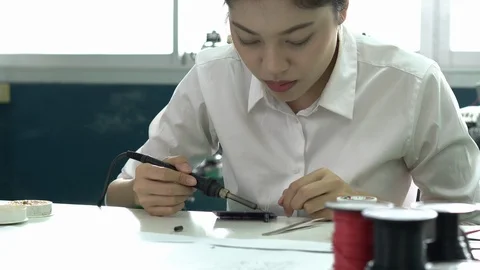 Engineer female design and developing microchip electronic of robot in labs. Stock Footage 112990808