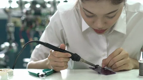 Engineer female design and developing microchip electronic of robot in labs. Stock Footage 112993029