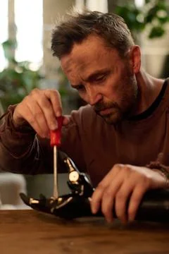 Engineer Fixing Bionic Arm Stock Photos