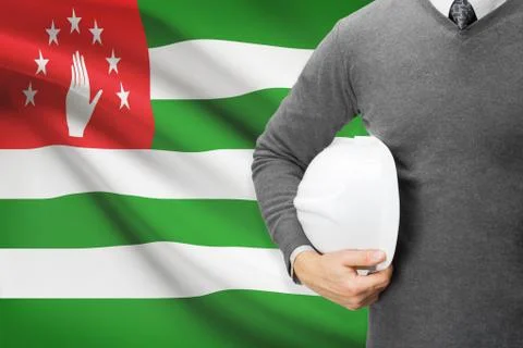 Engineer with flag on background  - abkhazia 写真素材