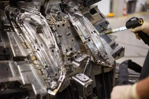 Engineer freezing injection mold after production by dry nitrogen, industrial 库存照片