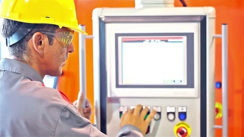 Engineer in the front of the control panel Stock Footage 70158801