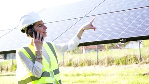 Engineer in front of solar panels Stock Footage 107012377