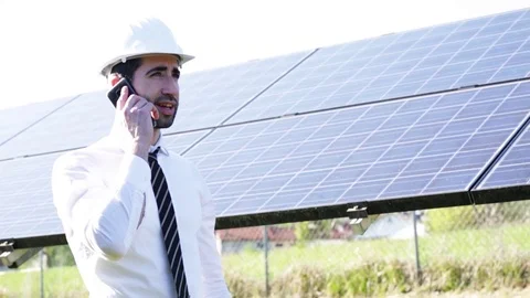 Engineer in front of solar panels Stock Footage 107012428