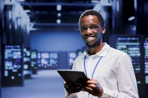 Engineer in front of supercomputers Stock Photos