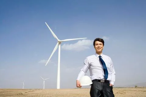 Engineer in front of wind turbines Stock-Fotos