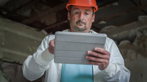 The engineer is getting acquainted with the economic calculations 2 Stock Footage 31135322