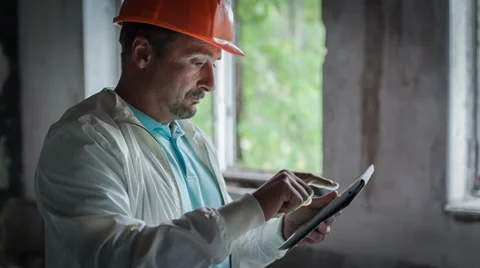 The engineer is getting acquainted with the economic calculations 4 Stock Footage 31135832