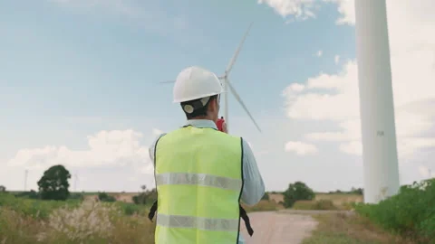 Engineer is giving orders with a walkie-talkie while inspecting work Stock Footage 274381729