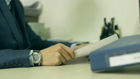 An engineer is giving proven schemes to an office worker Stock Footage 73783109