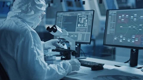 Engineer Gloves Uses Microscope to Inspect Samples, Developing High Tech Video stock 126151947