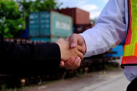 The engineer guy is shaking hands with construction manager. Stock Photos
