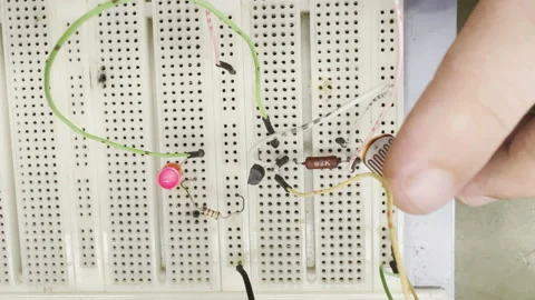 Engineer Hand Testing Capacitive Touch Button On Electronic Breadboard Stock Footage 173174274